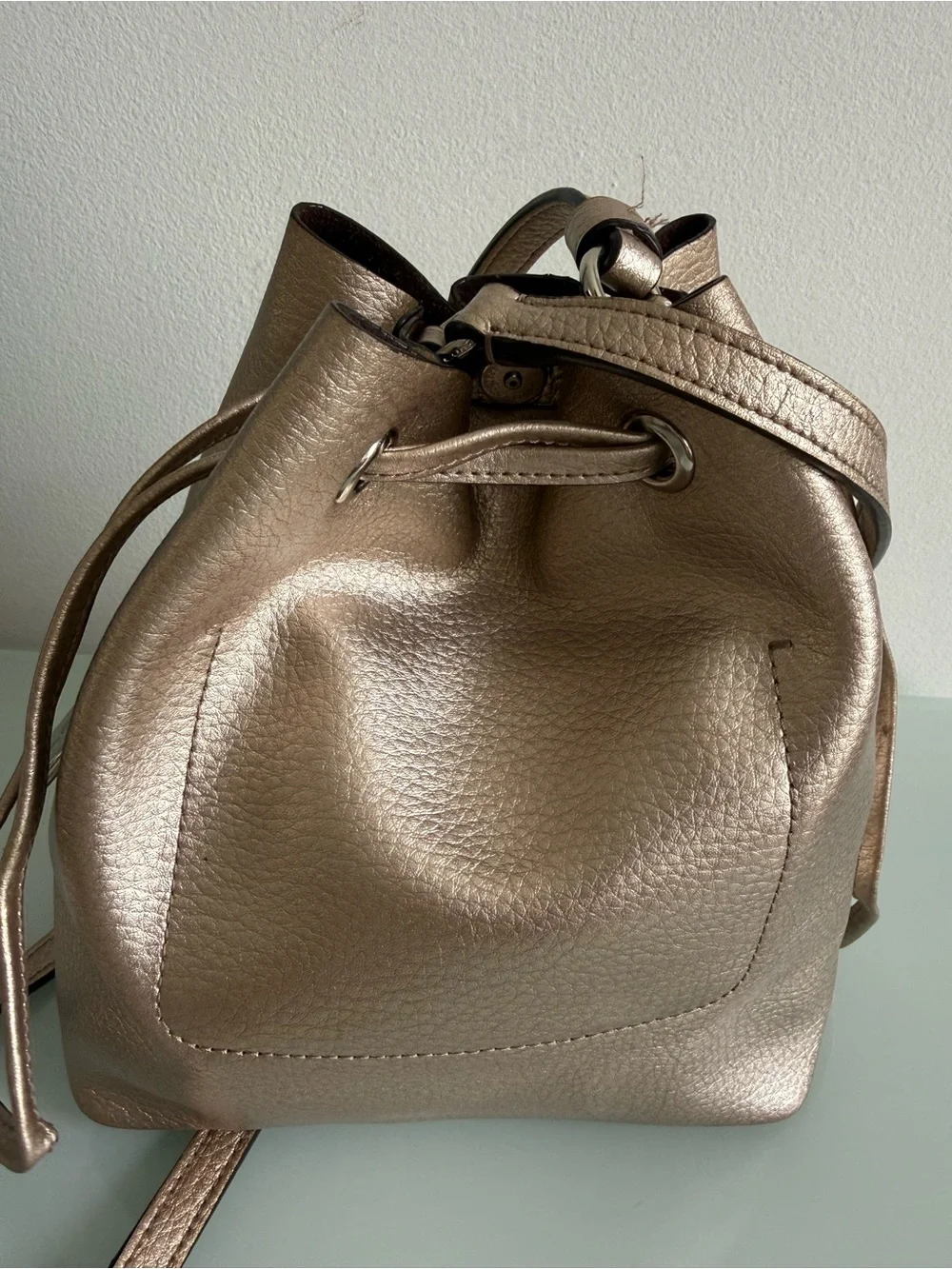 Coach Metallic Rose Gold Leather Drawstring Crossbody Bag